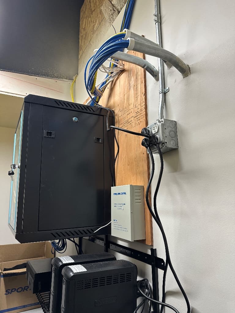 Commercial network equipment room and rack documented by Dunlap